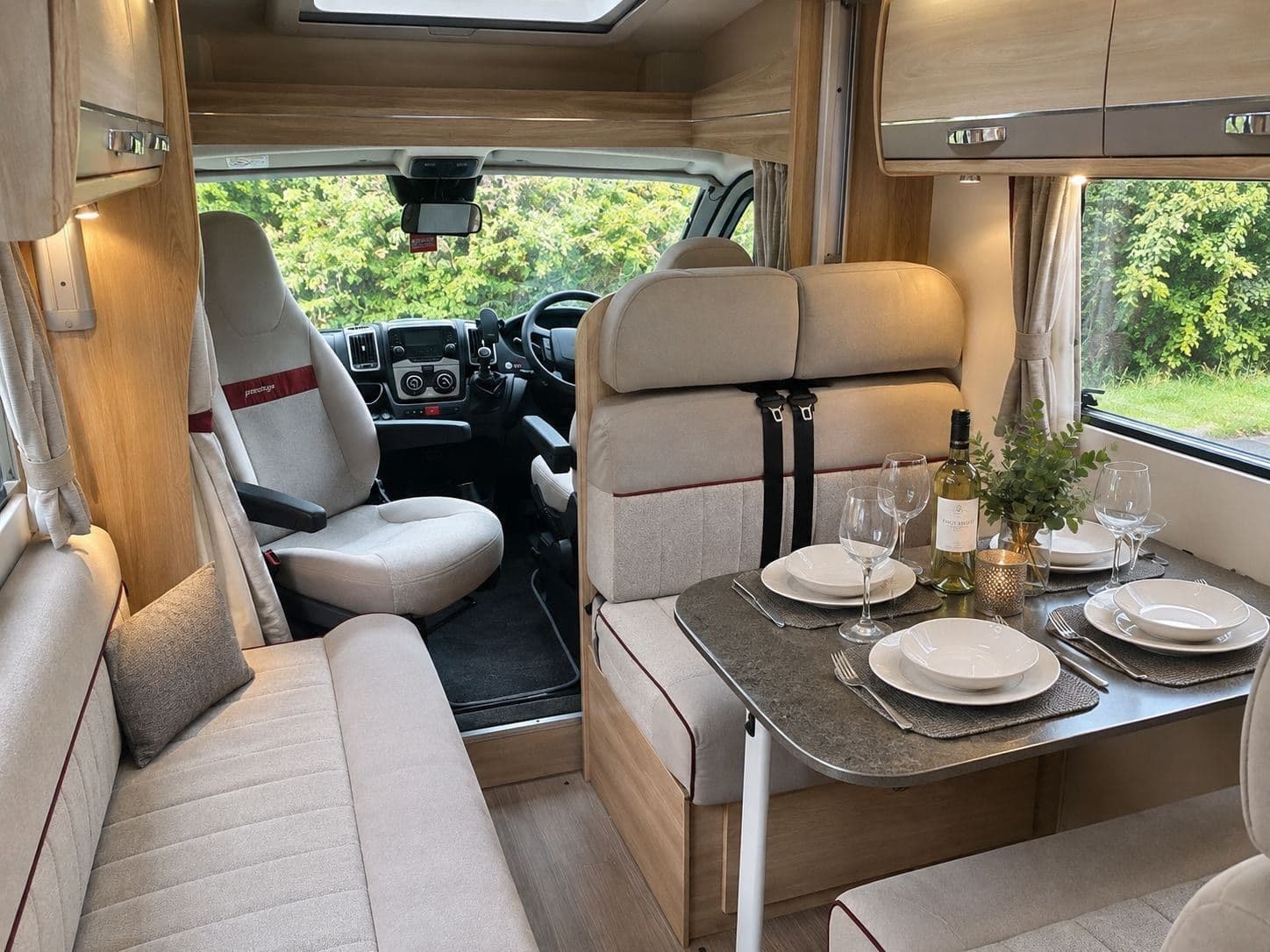 The dinette laid for four, with the swivelled cab seats beyond