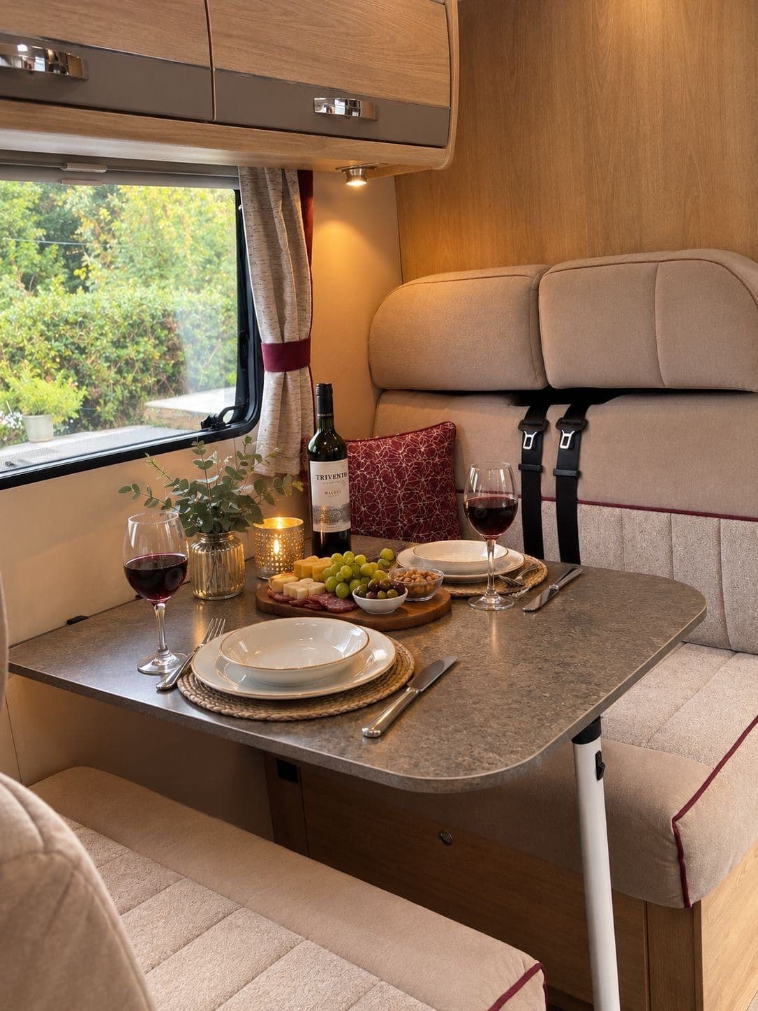 The side dinette set for dinner, with the belted travel seats behind